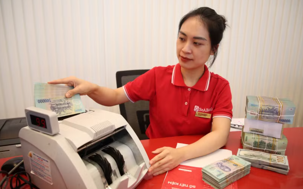 Ngân hàng Nhà nước chỉ đạo giảm lãi, tiếp vốn cho doanh nghiệp nhỏ và vừa. (Ảnh: Vietnam+)